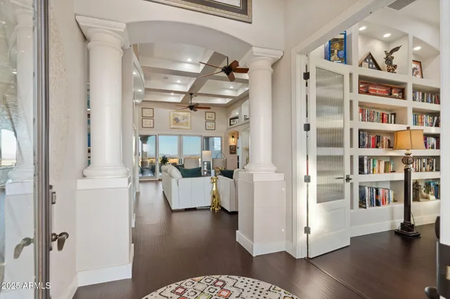 a view of living room with furniture and wooden floor