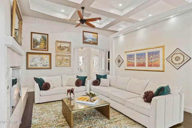 a living room with furniture and a rug