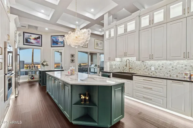 a kitchen with stainless steel appliances granite countertop a sink and cabinets
