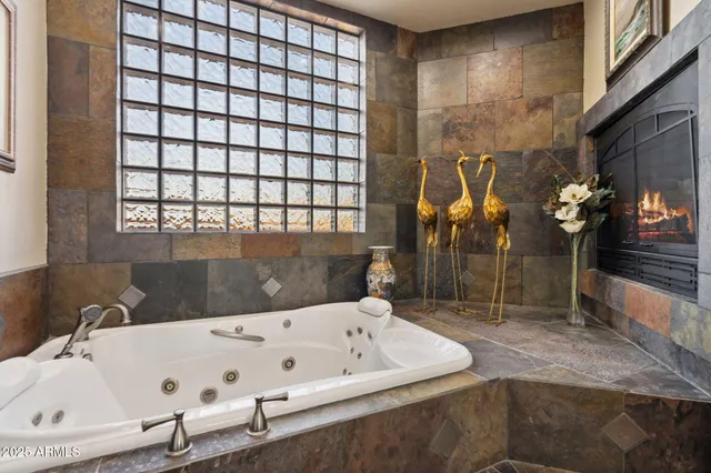 a bathroom with a bathtub and shower