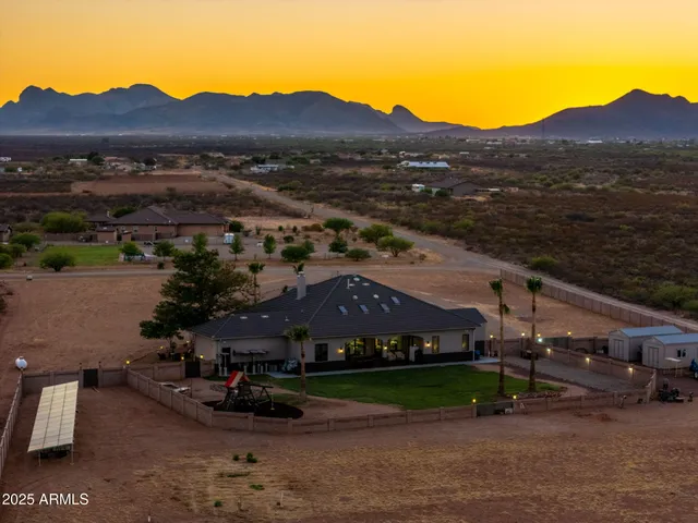 an aerial view of a house with an outdoor space