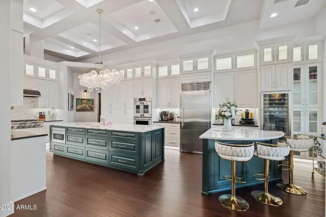 a kitchen with stainless steel appliances granite countertop a stove and a refrigerator