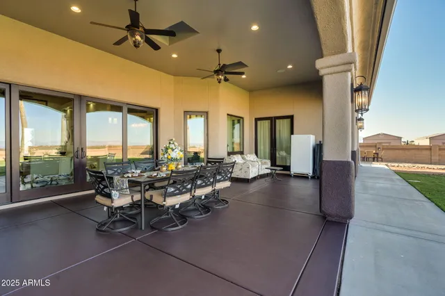 a view of a livingroom with furniture and a large window