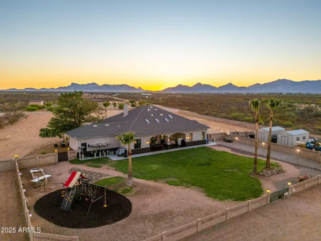 a view of a garden with a house