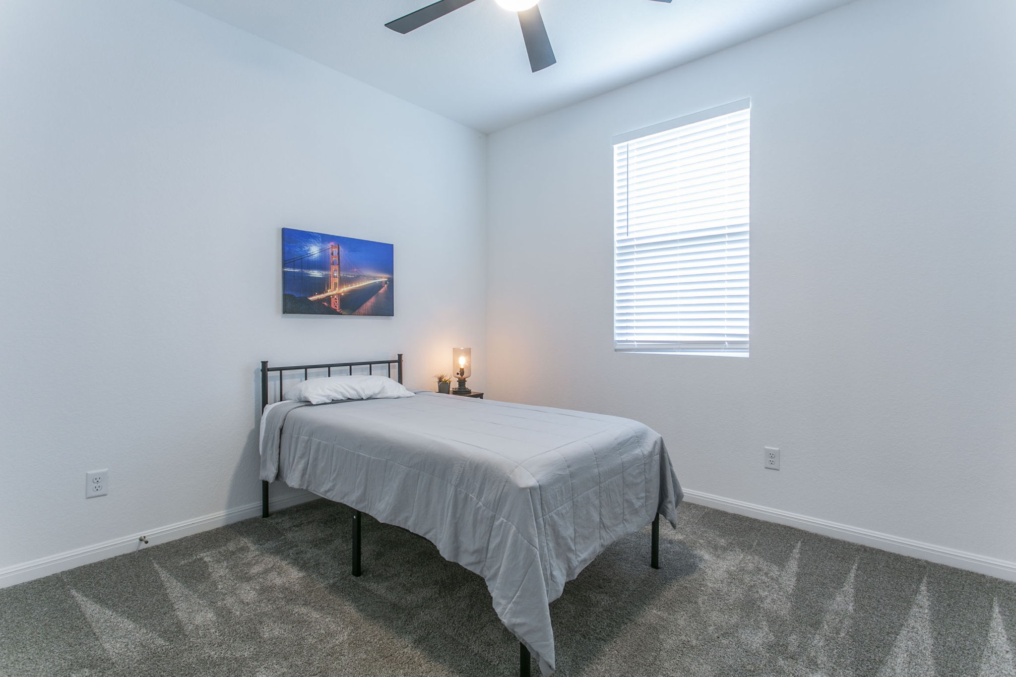 228 Citation Drive Jarrell, TX 76537 - Photo 25 of 30 a bedroom with a bed and a chandelier