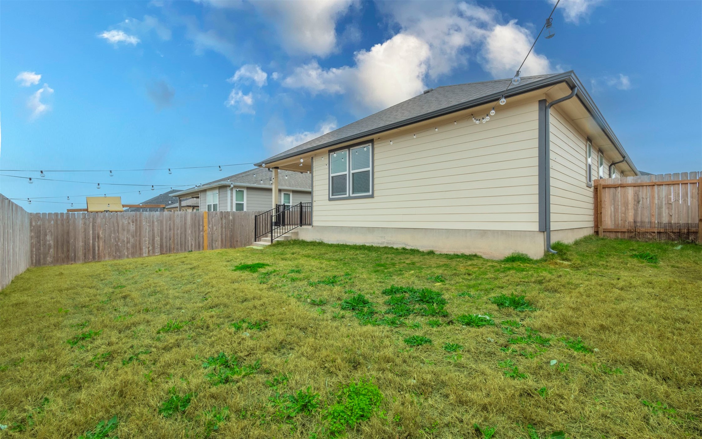 228 Citation Drive Jarrell, TX 76537 - Photo 26 of 30 a view of a backyard with plants and wooden fence