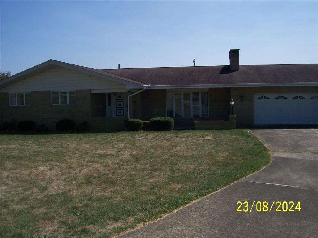 748 Narrows Road Connellsville, PA 15425 - Photo 1 of 32 a front view of a house with a yard