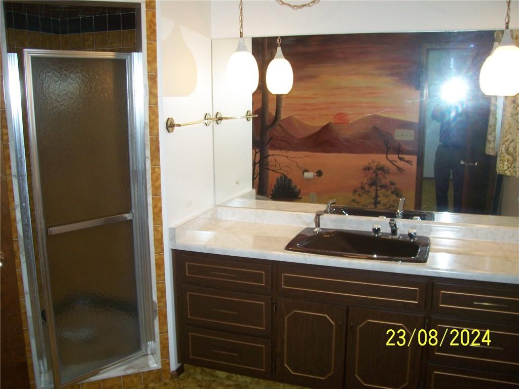 748 Narrows Road Connellsville, PA 15425 - Photo 13 of 32 a bathroom with a sink and a mirror