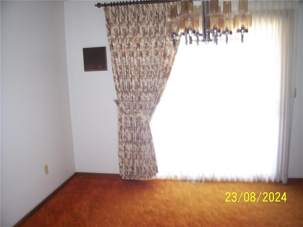 748 Narrows Road Connellsville, PA 15425 - Photo 29 of 32 a view of a room with a fireplace and a window