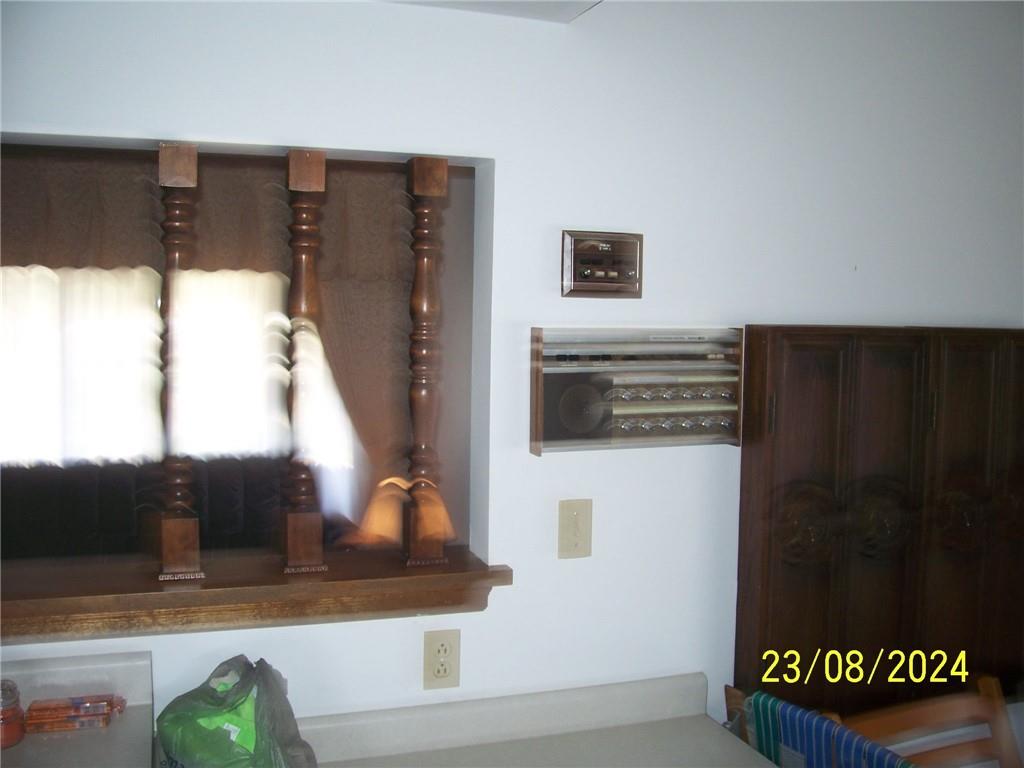 748 Narrows Road Connellsville, PA 15425 - Photo 3 of 32 a view of a living room with a flat tv screen and a fireplace