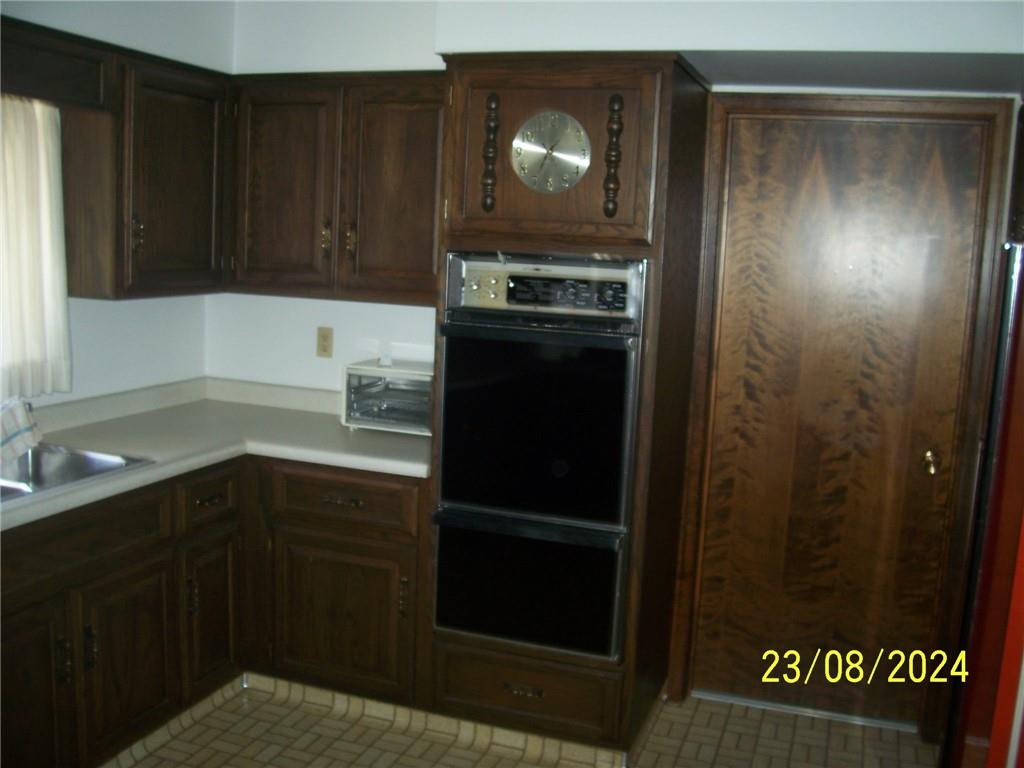 748 Narrows Road Connellsville, PA 15425 - Photo 31 of 32 a kitchen with a refrigerator and a sink