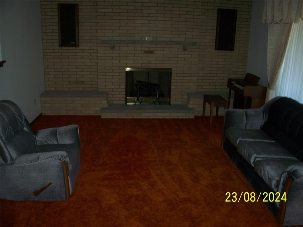 748 Narrows Road Connellsville, PA 15425 - Photo 4 of 32 a living room with furniture and a fireplace