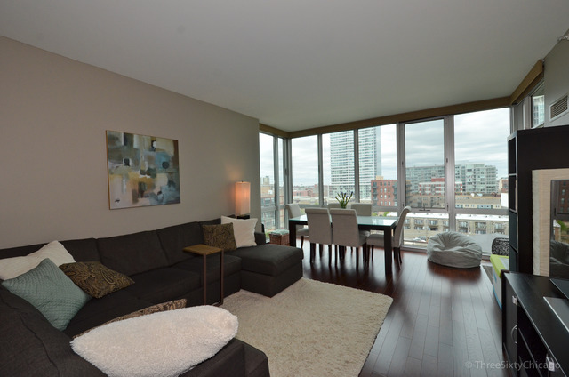 1629 South Prairie Avenue, Unit 809 Chicago, IL 60616 - Photo 2 of 24 a living room with furniture large windows and a dining table with garden view