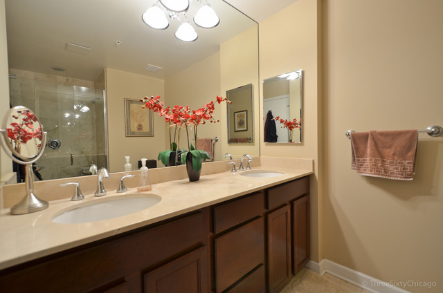 1629 South Prairie Avenue, Unit 809 Chicago, IL 60616 - Photo 11 of 24 a bathroom with a double vanity sink and a mirror