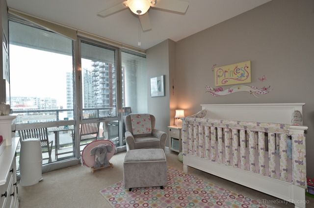 1629 South Prairie Avenue, Unit 809 Chicago, IL 60616 - Photo 13 of 24 a bedroom with furniture and a large window
