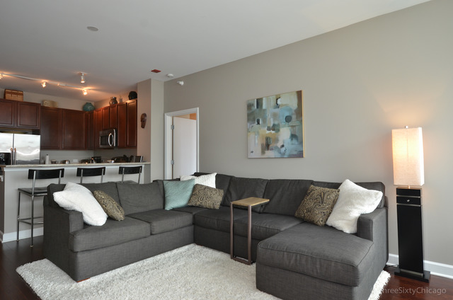 1629 South Prairie Avenue, Unit 809 Chicago, IL 60616 - Photo 4 of 24 a living room with furniture and a view of kitchen