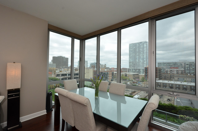 1629 South Prairie Avenue, Unit 809 Chicago, IL 60616 - Photo 8 of 24 a living room with furniture and a floor to ceiling window
