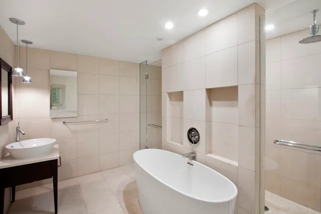 a bathroom with a sink and a large mirror