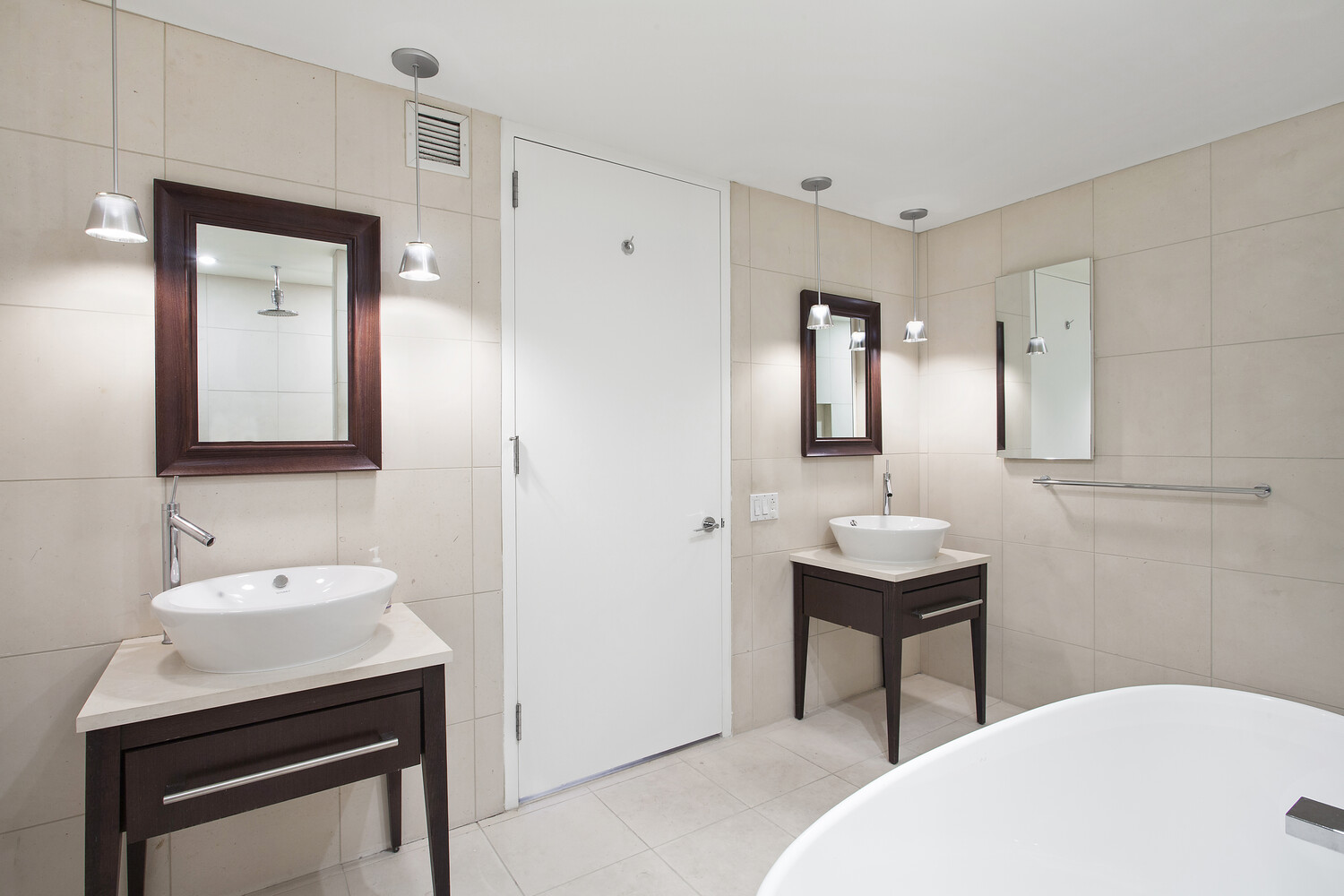 340 East 23rd Street, Unit 6E Manhattan, NY 10010 - Photo 4 of 6 a bathroom with a sink a toilet and mirror