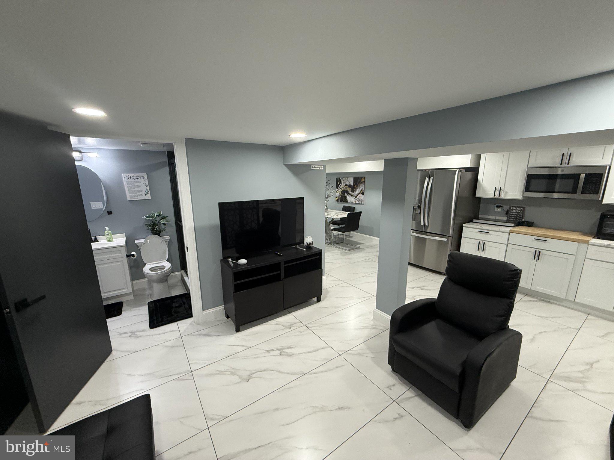 7022 Highbridge Road, Unit 2 Bowie, MD 20720 - Photo 2 of 11 Modern basement retreat with sleek design.