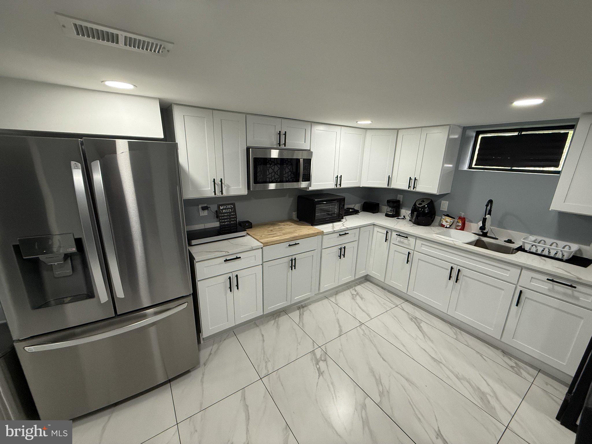 7022 Highbridge Road, Unit 2 Bowie, MD 20720 - Photo 3 of 11 Modern kitchen with sleek finishes.