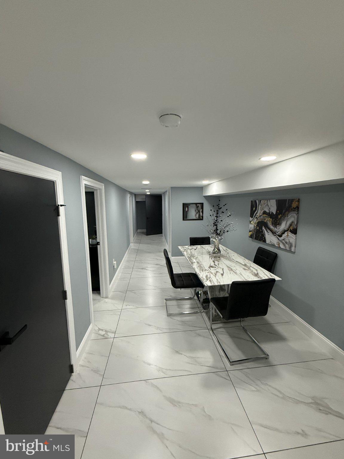 7022 Highbridge Road, Unit 2 Bowie, MD 20720 - Photo 5 of 11 Sleek hallway with modern dining area.