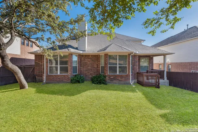 a view of a house with a yard porch and sitting area