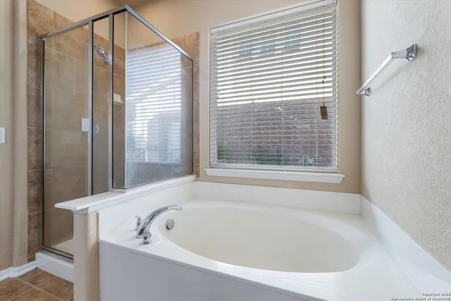 a white bath tub sitting next to a window
