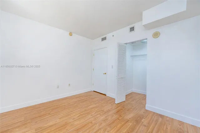 a view of room with wooden floor