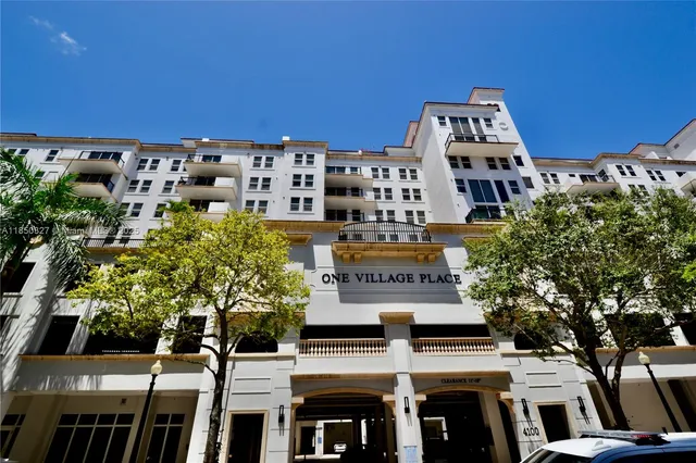 a view of a building with garden space and windows