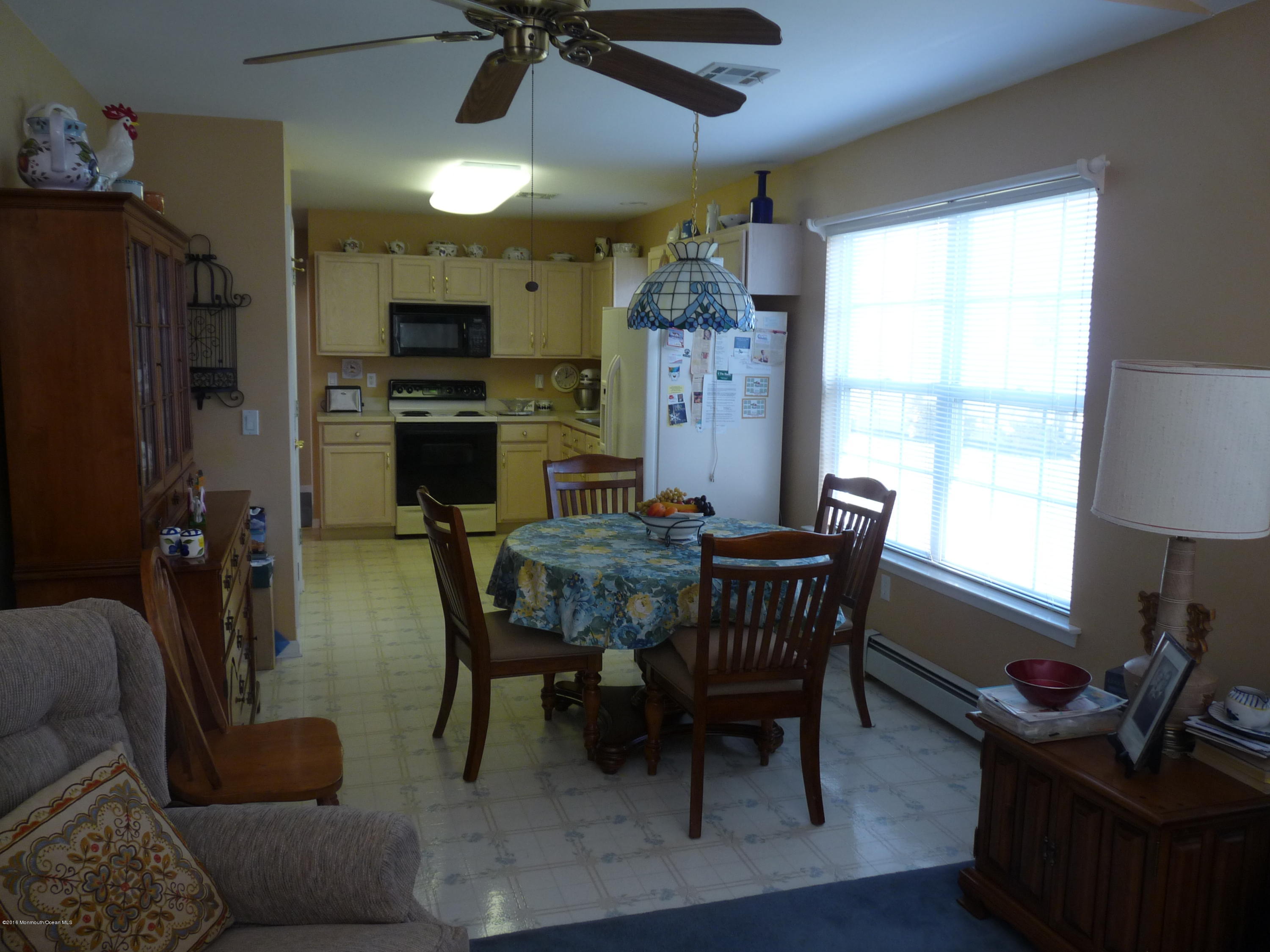 14 Clear Lake Road Whiting, NJ 08759 - Photo 8 of 29 Eating area (ceiling fan beyond the tabl