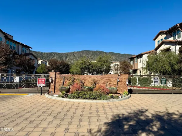 a view of houses with a street