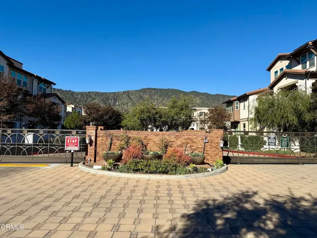 a view of houses with a street