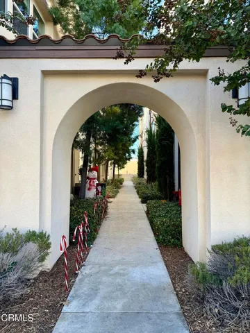 an entrance view with a garden and plants