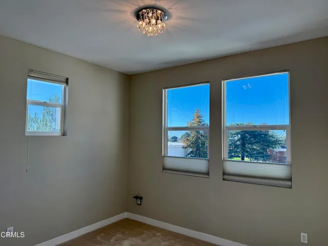 a view of a hallway with a large window