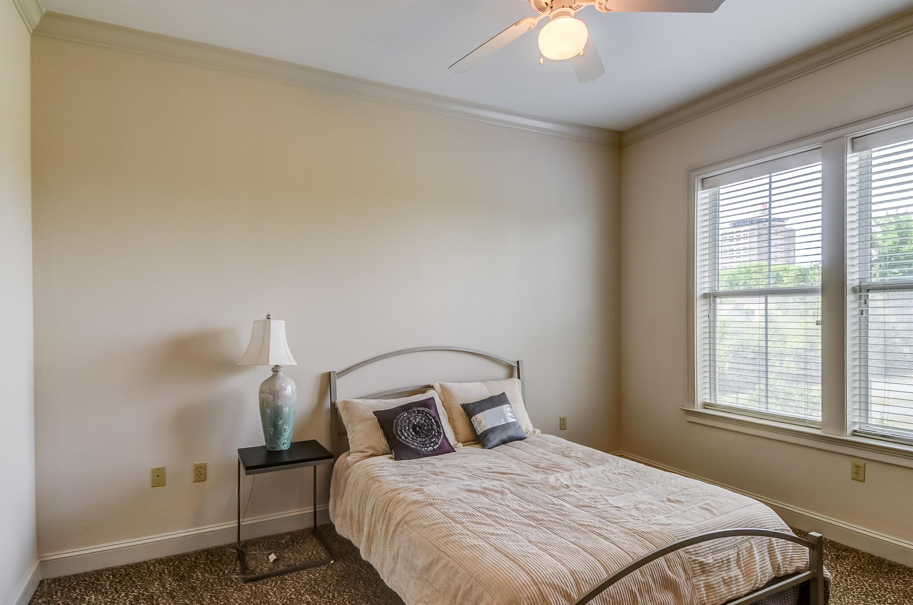 591 Lexington Road, Unit 303 Memphis, TN 38117 - Photo 25 of 34 a bedroom with a bed and a window