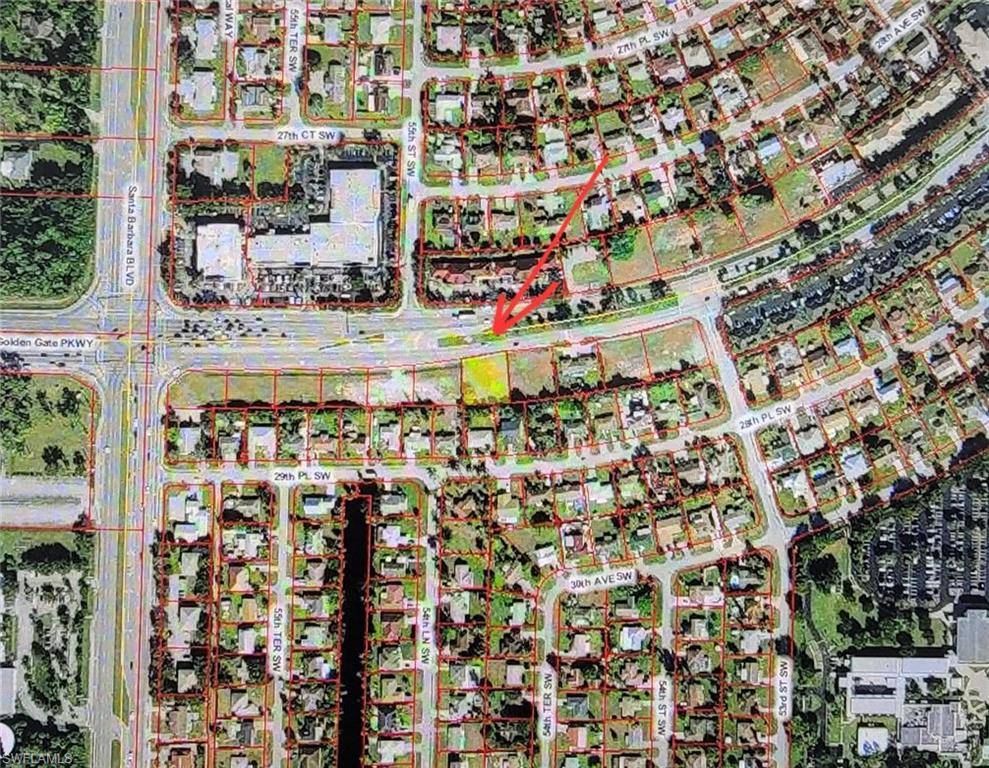 5472 Golden Gate Parkway Naples, FL 34116 - Photo 2 of 4 a city view with tall buildings