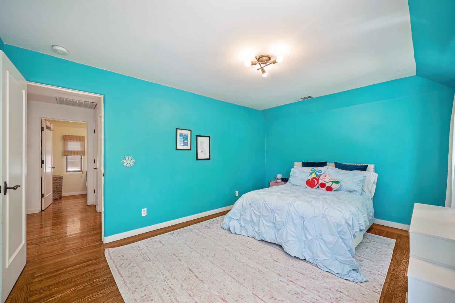 3501 Cutter Way Sacramento, CA 95818 - Photo 64 of 89 a bedroom with a bed and wooden floor