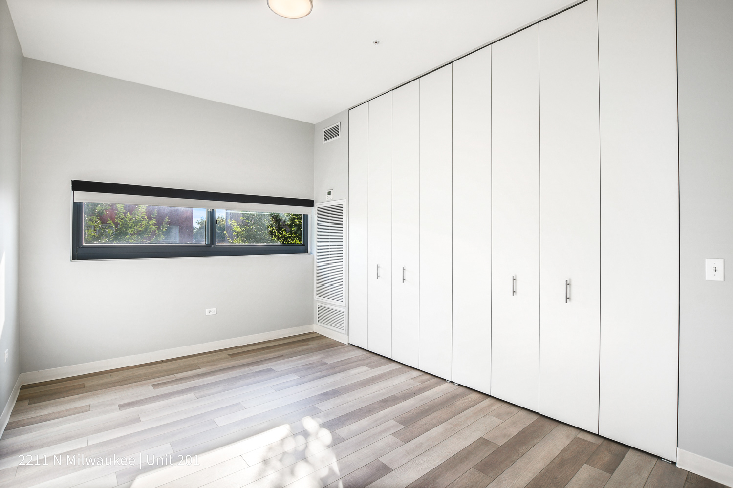 Undisclosed Address Chicago, IL 60647 - Photo 13 of 23 a view of empty room with wooden floor and fan