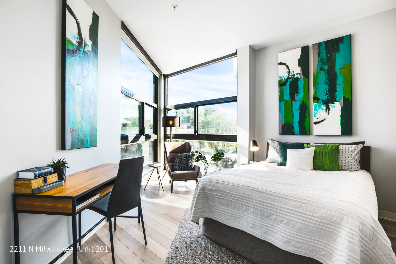 Undisclosed Address Chicago, IL 60647 - Photo 16 of 23 a bedroom with a bed and large windows