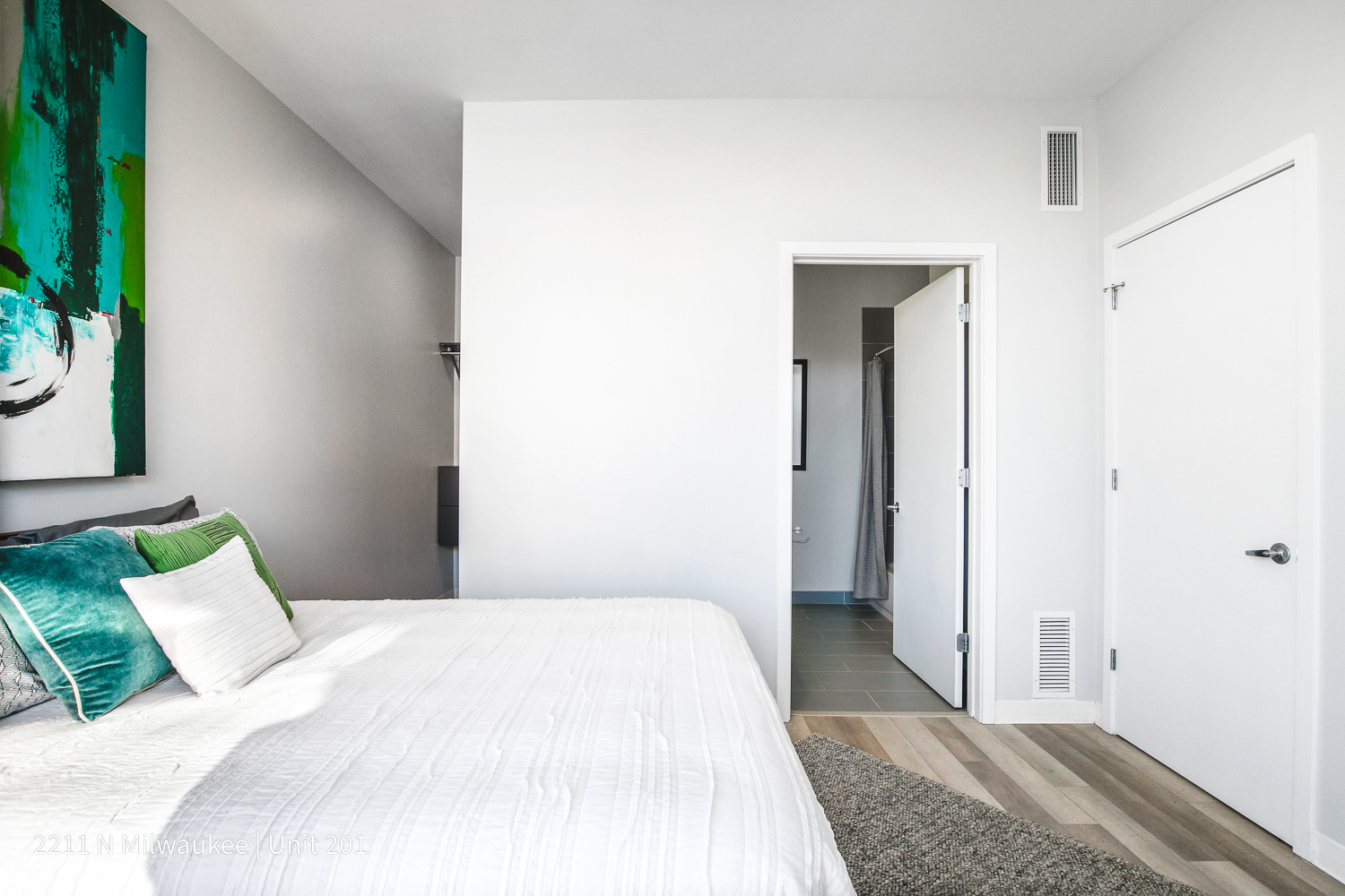 Undisclosed Address Chicago, IL 60647 - Photo 17 of 23 a bedroom with a bed and a potted plant