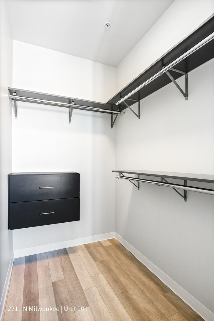 Undisclosed Address Chicago, IL 60647 - Photo 18 of 23 a view of a room with an empty walk in closet