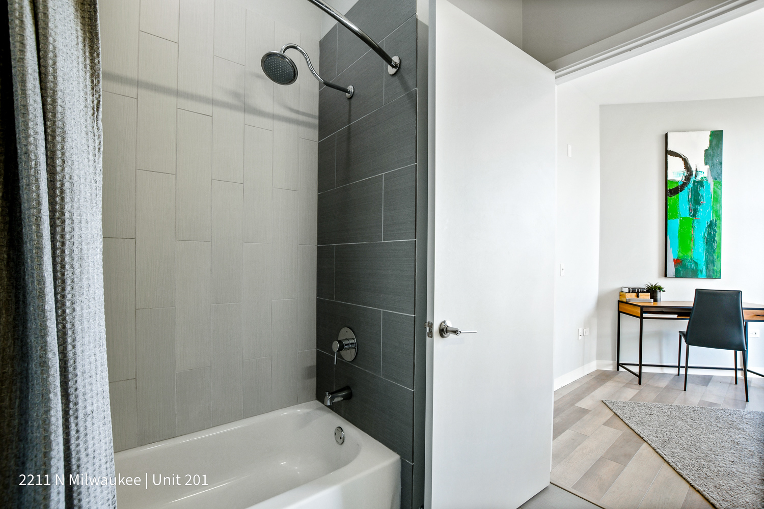 Undisclosed Address Chicago, IL 60647 - Photo 20 of 23 a bathroom with a tub a sink and a shower