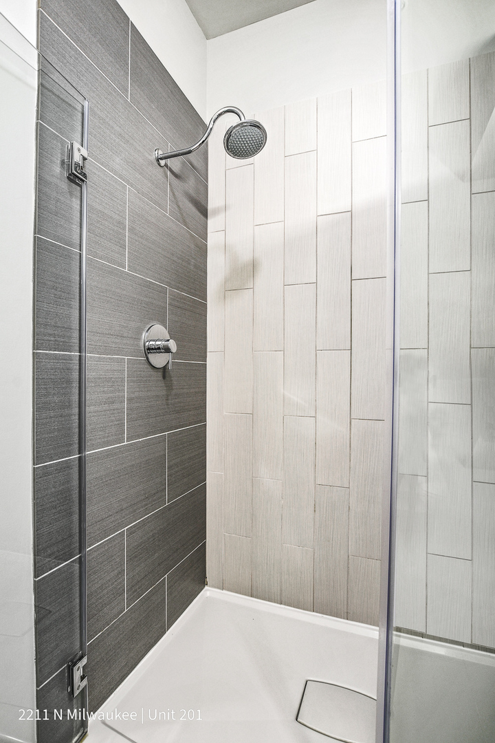 Undisclosed Address Chicago, IL 60647 - Photo 4 of 23 a bathroom with a shower