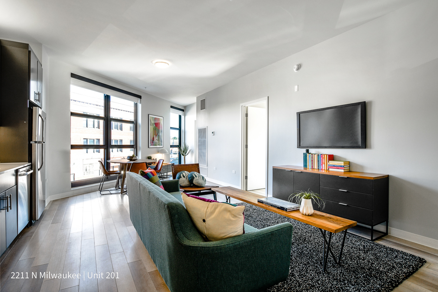 Undisclosed Address Chicago, IL 60647 - Photo 5 of 23 a living room with furniture and a flat screen tv