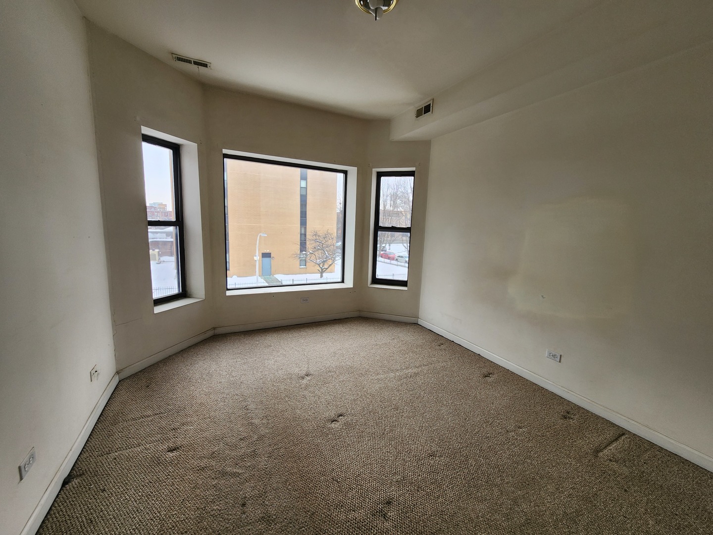 346 East 41st Street, Unit 2 Chicago, IL 60653 - Photo 8 of 9 an empty room with windows
