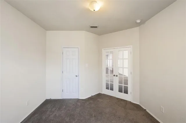 a view of hallway with chandelier