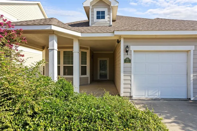 front view of a house with a small yard