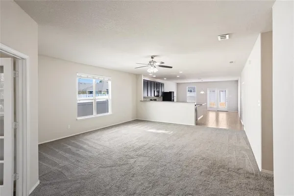 a view of a big room with windows and cabinet