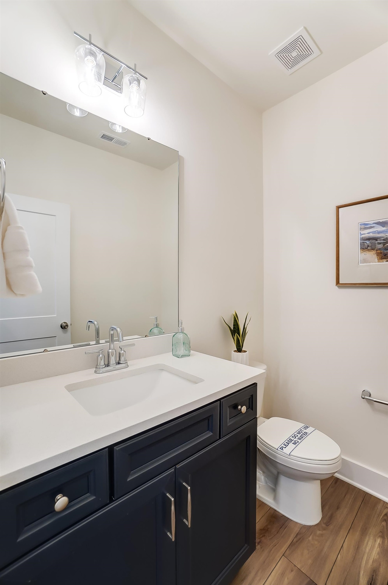 3450 Piedmont Drive Raleigh, NC 27604 - Photo 18 of 34 a bathroom with a sink a toilet and mirror